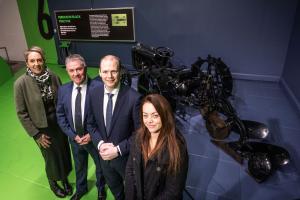 Communities Minister Gordon Lyons views the iconic Ferguson Black Tractor at the Ulster Transport Museum with representatives from National Museums NI. 