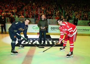 Communities Minister Gordon Lyons drops the puck at Friendship Four Ice Hockey Tournament.  Pictured with two captains