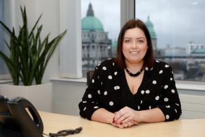 Minister Hargey sitting at her desk