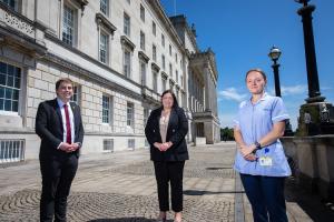 Communities Minister Deirdre Hargey is pictured with Kasia Patynowska Registered Nurse at Marie Curie and Craig Harrison Marie Curie Policy Manager.