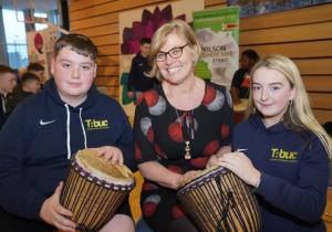 DfC Permanent Secretary Tracy Meharg with two children from Ardoyne and Ballysillan